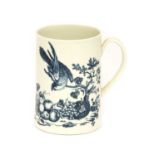 A Worcester Porcelain Mug, circa 1775, printed in underglaze blue with the Parrot Pecking Fruit