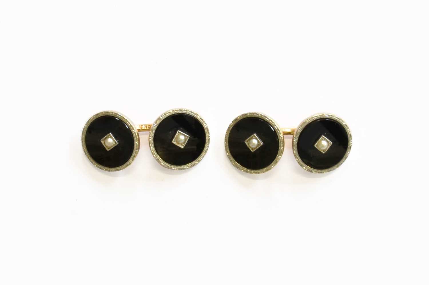 A Pair of Onyx and Split Pearl Cufflinks, formed of chain linked circular onyx plaques with a