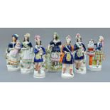 A Collection of Fourteen Victorian Staffordshire Pottery Figures, including three graces pocket
