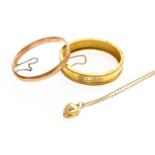 A 9 Carat Gold Hinged Bangle, inner measurements 6.0cm by 5.4cm; A Locket on Chain, pendant length