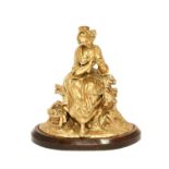 French School, 19th century: A Gilt Bronze Figure of a Seated Maiden, sitting on a tree stump a