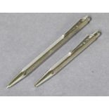 Two Caran d'Ache Ball Point Pens, each with engine-turned finish (2)