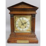 A German Oak Quarter Striking Table Clock, circa 1900, with presentation plaque, backplate stamped W