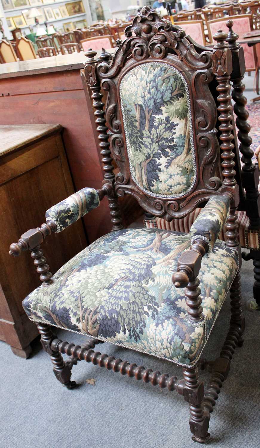 A Victorian Carved Oak Open Arm Hall Chair, decorated with acanthus leaves and bobbin-turned