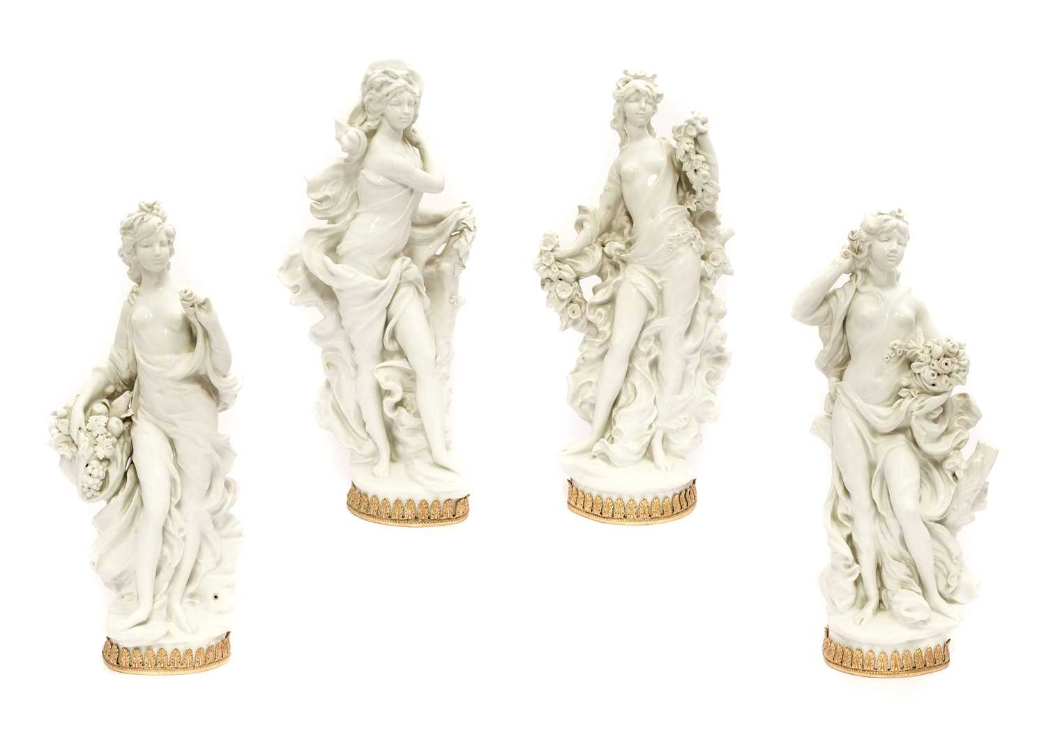 A Set of Four Royal Worcester White Porcelain Figures by Sir Arnold Machin, 20th century, as maidens