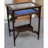 An Edwardian Mahogany Bijoterie Table, with blind fret carving, readed square tapering supports