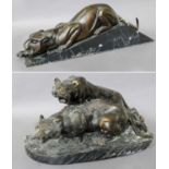 An Art Deco Style Large Bronzed Figure of a Tiger, 61cm long, on a black and marble plinth and a