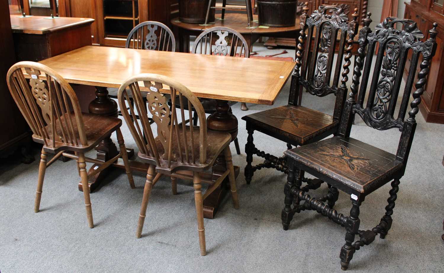 A 20th Century Oak Dining Table, with trestle base, Four Similar Wheel Back Windsor Chairs and A