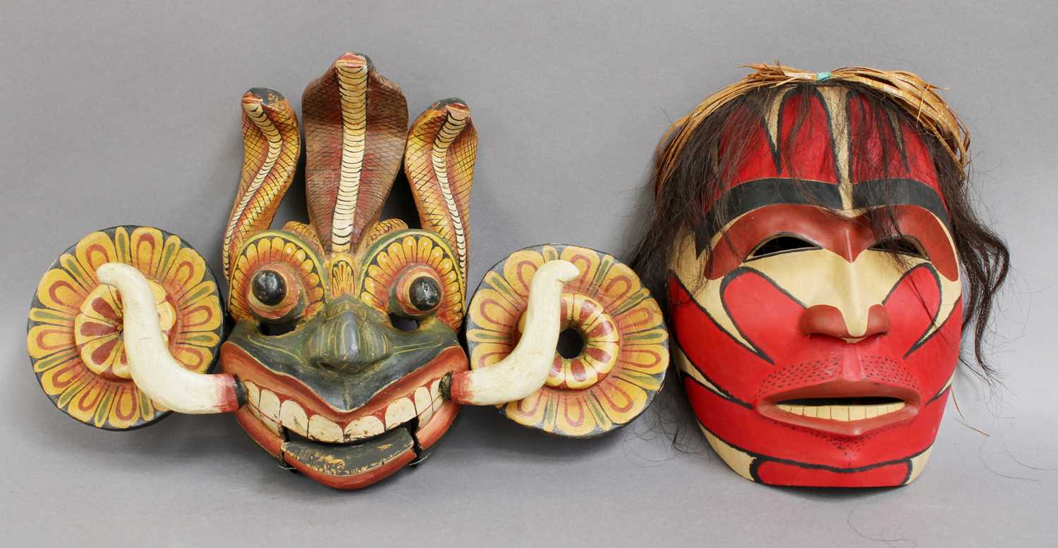 A Decorative Balinese Mask, together with another painted mask, each approx 24cm high