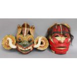 A Decorative Balinese Mask, together with another painted mask, each approx 24cm high