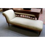 A Light Oak Framed Chaise Longue, set on casters, 198cm long