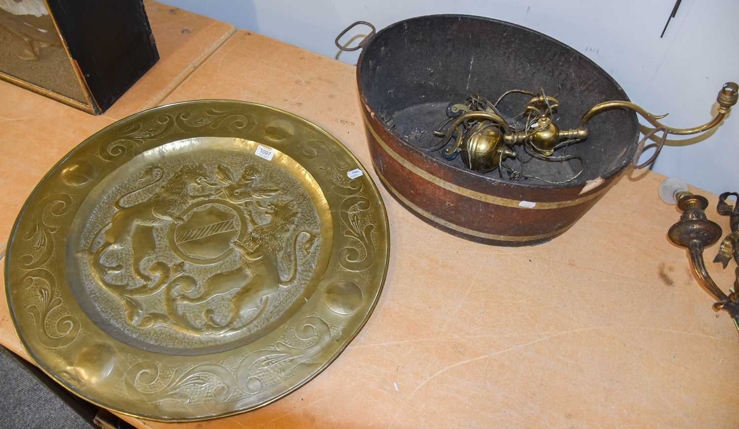 A Large 19th Century Brass Charger, possibly Dutch, embossed with a crest decorated with two