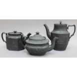 Two Early 19th Century Black Basalt Teapots and a Coffee Pot, (the coffee pot with associated