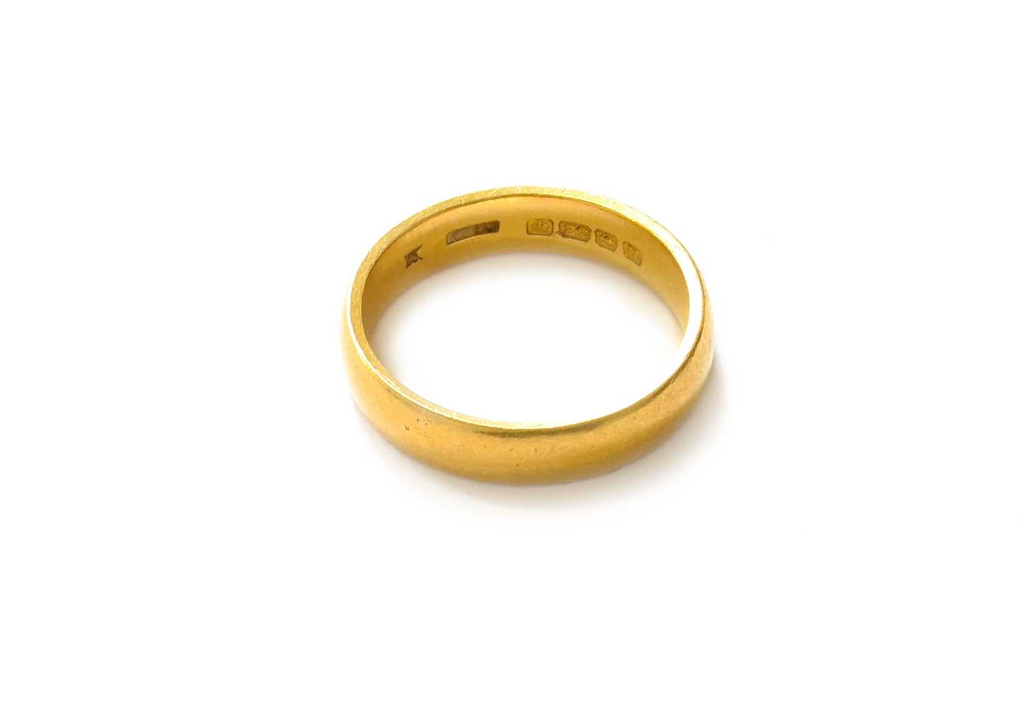 A 22 Carat Gold Band Ring, finger size M1/2Gross weight 5.9 grams.