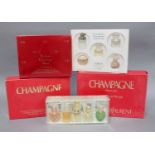Two Yves Saint-Laurent Champagne Perfume Gift Sets, another by Christian Dior and two mixed gifts