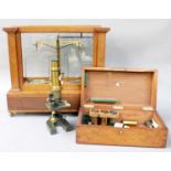 A Victorian Laquered Brass Microscope, in mahogany case, together with lenses for Baker of London; A