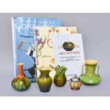 Linthorpe Pottery; Four green and brown glazed vases to include model No. 845, 958, 937, and 147,