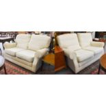 A Pair of Cream Upholstered Two-Seater Settees, each 145cm