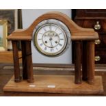A Rosewood Striking Portico Mantel Clock, the 6" enamel dial with a visible Brocot escapement to the