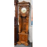 A Modern Quarter Striking Carved Longcase Clock, the case elaborately carved with masks and