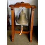 A Ship's Bell, later mounted on a mahogany cradle, and A Georgian Mahogany Corner Washstand (2)