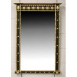 A Regency Style Gilt and Ebonised Inverted Breakfront Mirror, 68cm by 107cmEstimate £100-150.