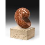 Darren Yeadon (b.1970)"Red Nautilus"Signed, Travertine, 39cm high (including base)