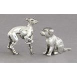 An Italian Silver model of a Greyhound, 43mm high; together With a silver plate dog ornament (2)