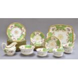 A 19th Century Coalport Green and Gilt Tea Service, painted with floral sprays; together with an