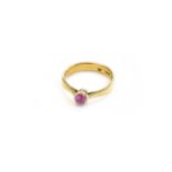 A 22 Carat Gold Synthetic Pink Sapphire Solitaire Ring, the oval cut synthetic pink sapphire in a
