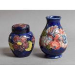 A Walter Moorcroft Pear Formed Vase, decorated with the Anemone pattern on a cobalt ground, 13cm
