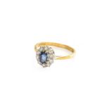 An 18 Carat Gold Sapphire and Diamond Cluster Ring, finger size MGross weight 3.0 grams.