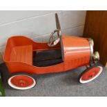A Red Pedal Car, in the form of an open topped single seater, registration 1929