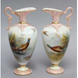 A Pair of Grainger & Co Worcester Ewers, with pierced spouts, painted with pheasants, 16cm highIn