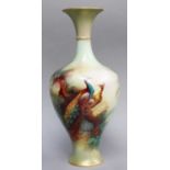 A Royal Worcester Vase, painted with peacocks, signed Jarman, 29cm high Some minor paint