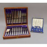 A Cased Set of Six Elizabeth II Silver and Harlequin Enamel Demitasse Spoons, by Henry Clifford