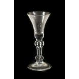 A Wine Glass, circa 1730, the bell-shaped bowl on inverted baluster stem with air tear and basal