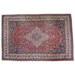 Isfahan CarpetCentral Iran, circa 1950The deep terracotta field with scrolling vines and serrated