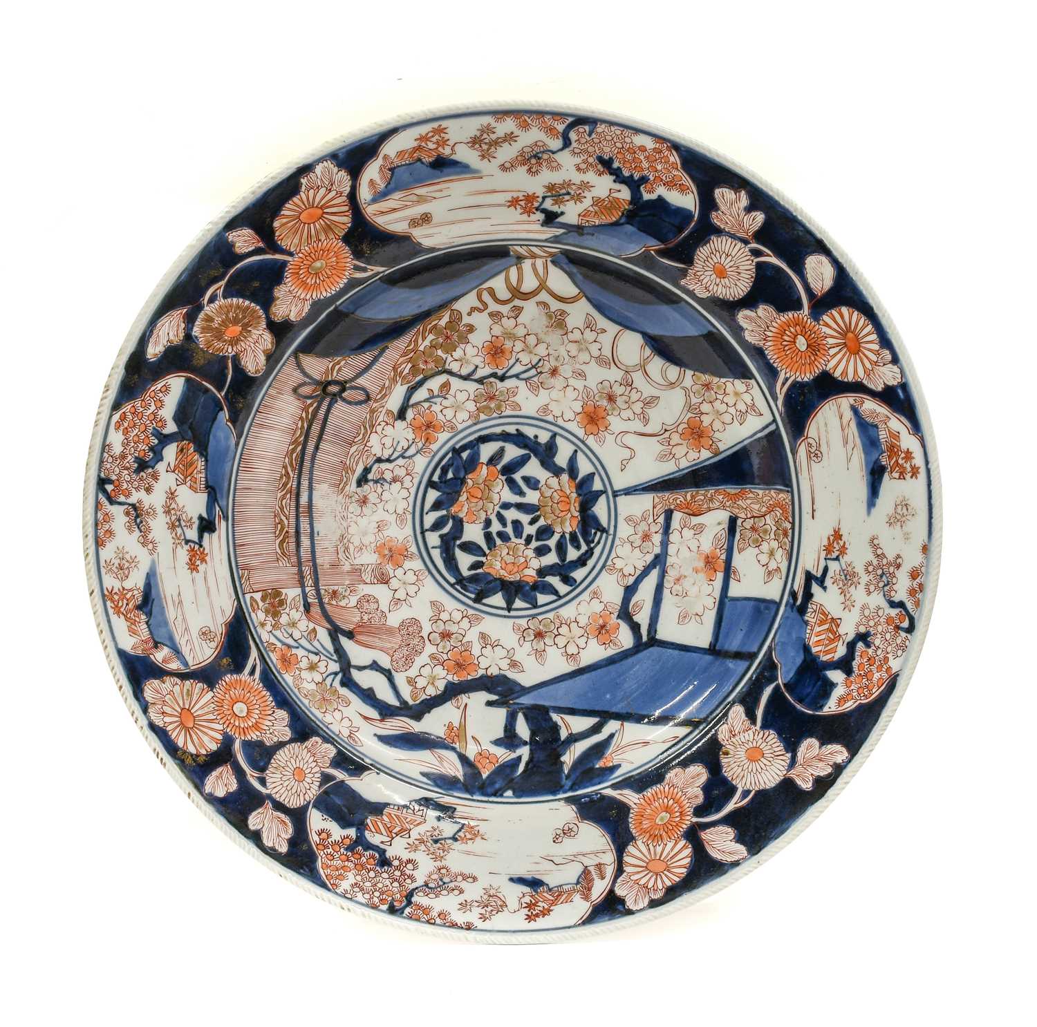An Imari Porcelain Dish, Edo period, circa 1700, typically painted with a central roundel of flowers