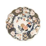 A Chelsea Porcelain Dish, circa 1755, of lobed circular form, painted in the Imari palette with a