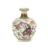 A Chinese Porcelain Vase, 19th century, of ovoid form with trumpet neck, painted in famille rose