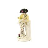 A Bow Porcelain Figure of a Shepherd, circa 1758, leaning against a tree trunk playing a pipe, his