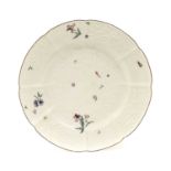 A Chelsea Porcelain Plate, of Gotskowsky Type, circa 1755, painted with scattered sprigs and insects