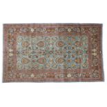 Ghom CarpetCentral Iran, circa 1970 The pale indigo field with columns of flowers and serrated