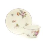 A Chelsea Porcelain Tea Bowl and Saucer, circa 1755, painted with flowersprays and scattered