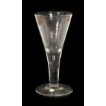 A Glass Goblet, circa 1740, the drawn trumpet bowl on a plain stem with air tear and folded foot21cm