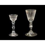 A Wine Glass, probably German, circa 1750, the rounded funnel bowl with engraved foliate and