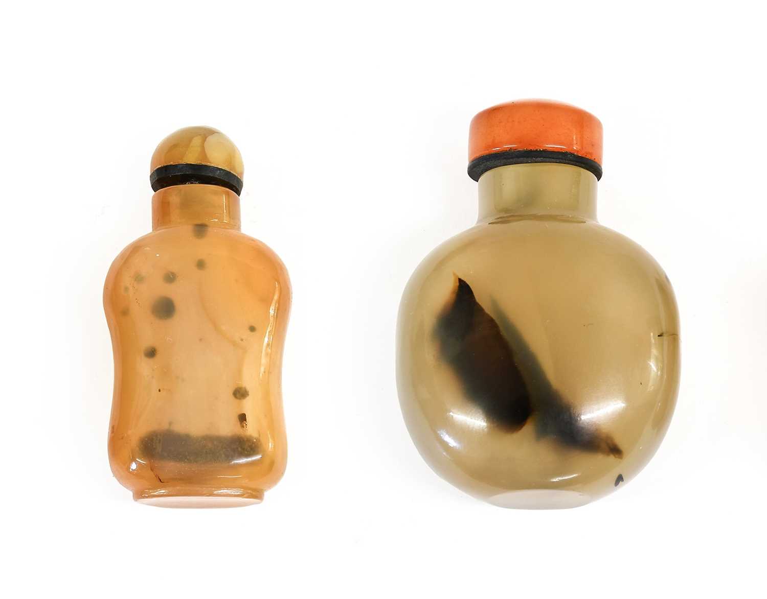 A Chinese Agate Snuff Bottle and Stopper, of flattened ovoid form with dark inclusions6.5cm highA
