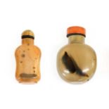 A Chinese Agate Snuff Bottle and Stopper, of flattened ovoid form with dark inclusions6.5cm highA