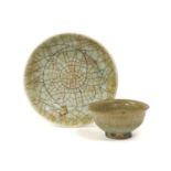 A Guan-Type Celadon-Glazed Saucer Dish, in Song style, with allover two colour crackle22cm diameterA